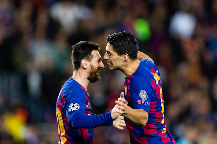 Lionel Messi (left) and Luis Suarez pictured celebrating a goal during Barcelona's win over Dortmund in November 2019